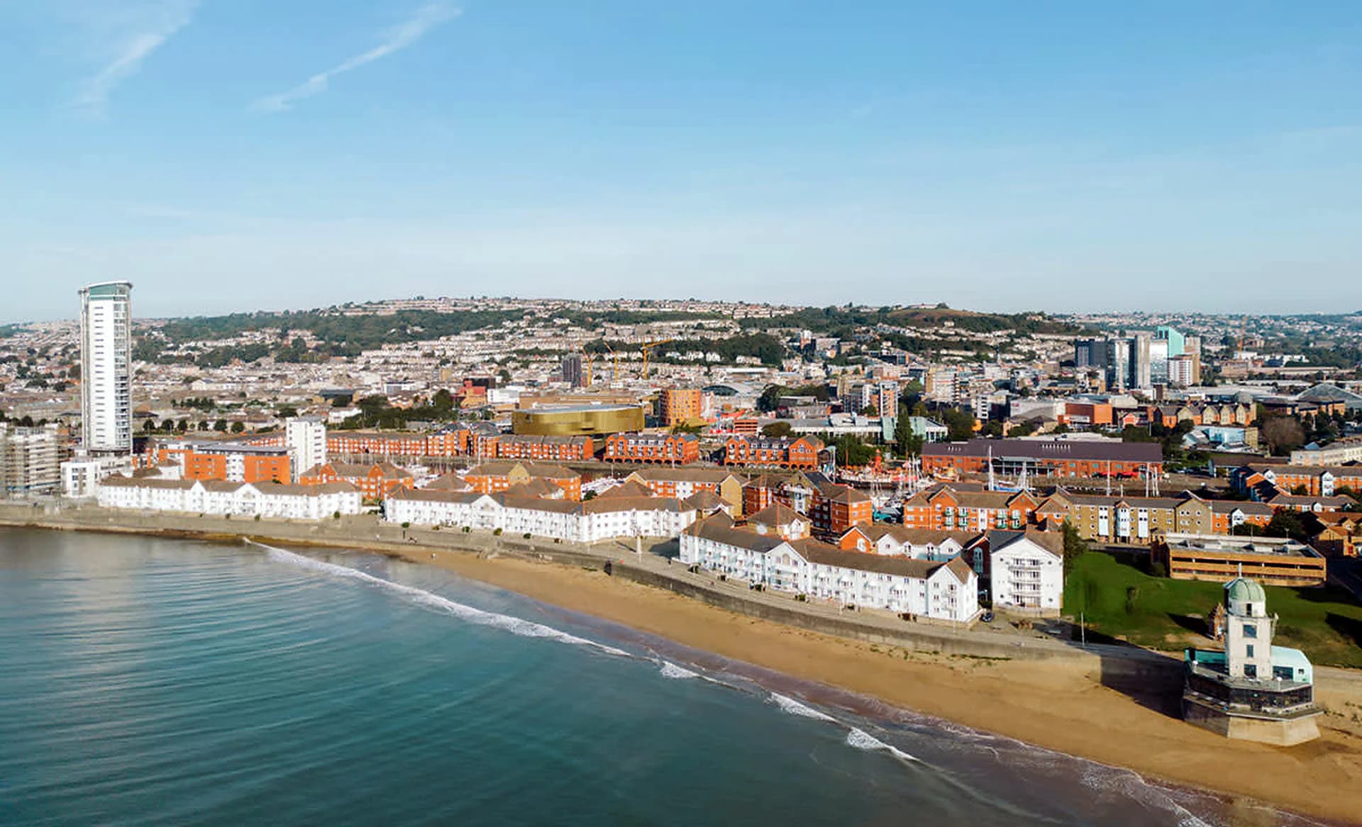 Wide daytime view across Swansea city waterfront and Swansea Bay